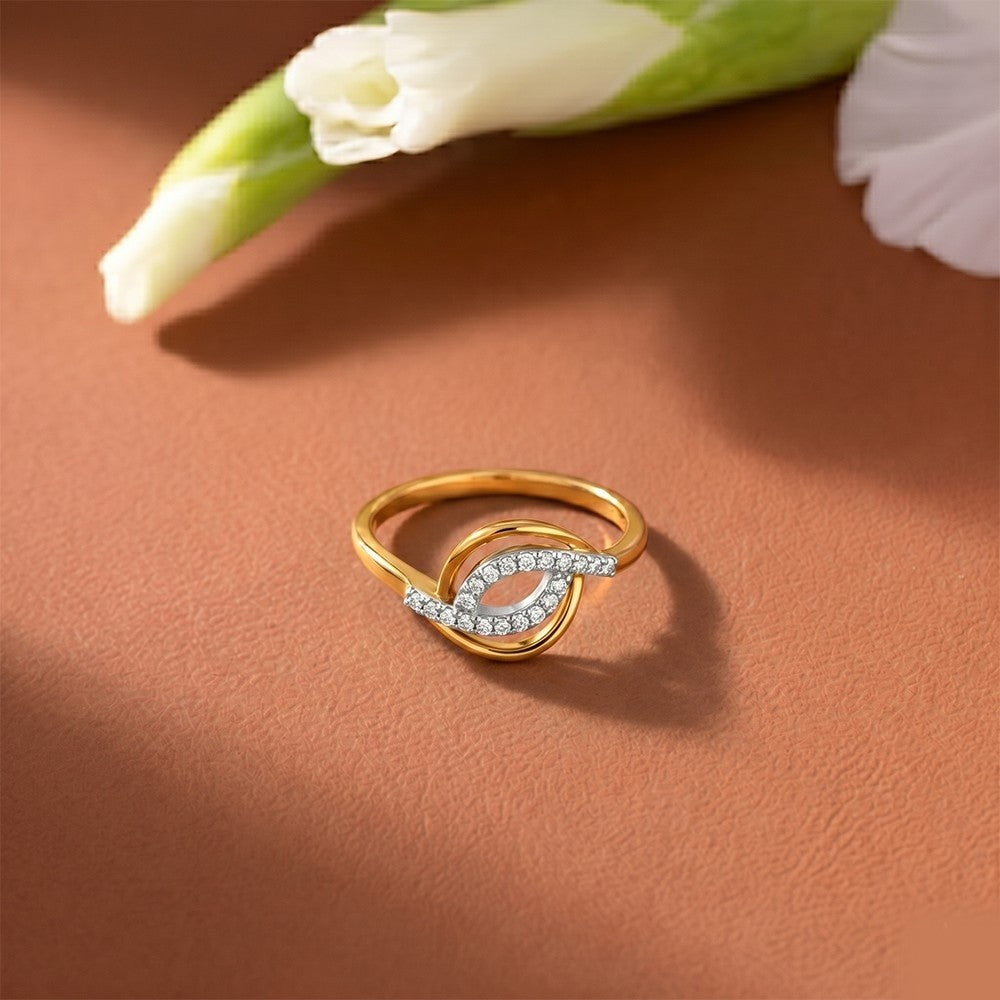 Gold and diamond with pavé-set accent diamonds on a texture surface.