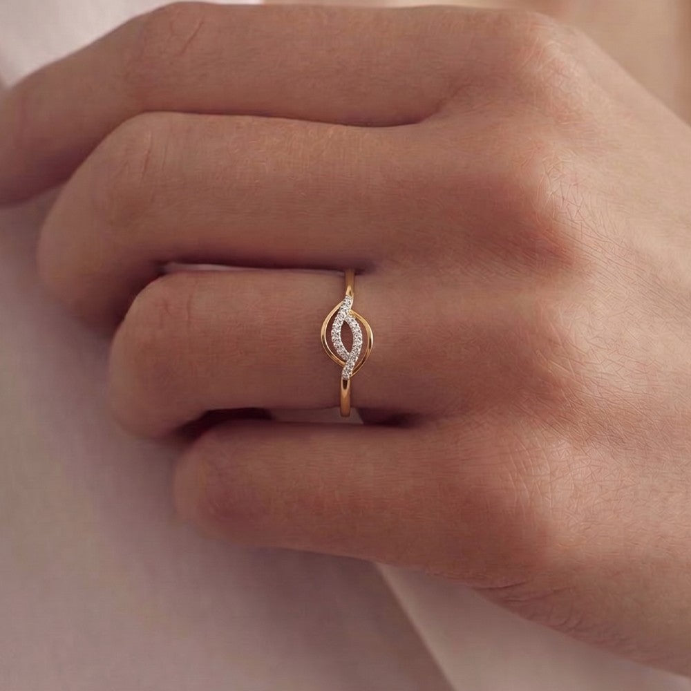 Close-up shot of a gold and diamond with pavé-set accent diamonds ring.