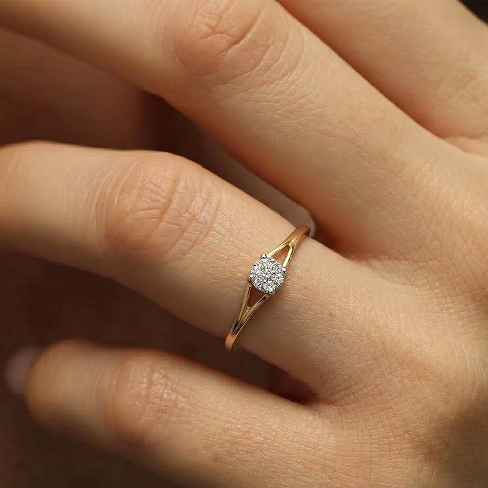 Close-up shot of a gold and diamond with cluster setting ring.