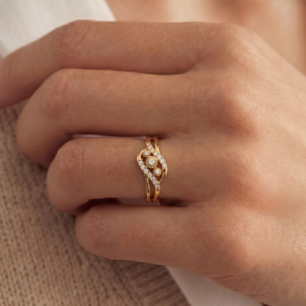 Close-up shot of a gold and diamond women's ring.