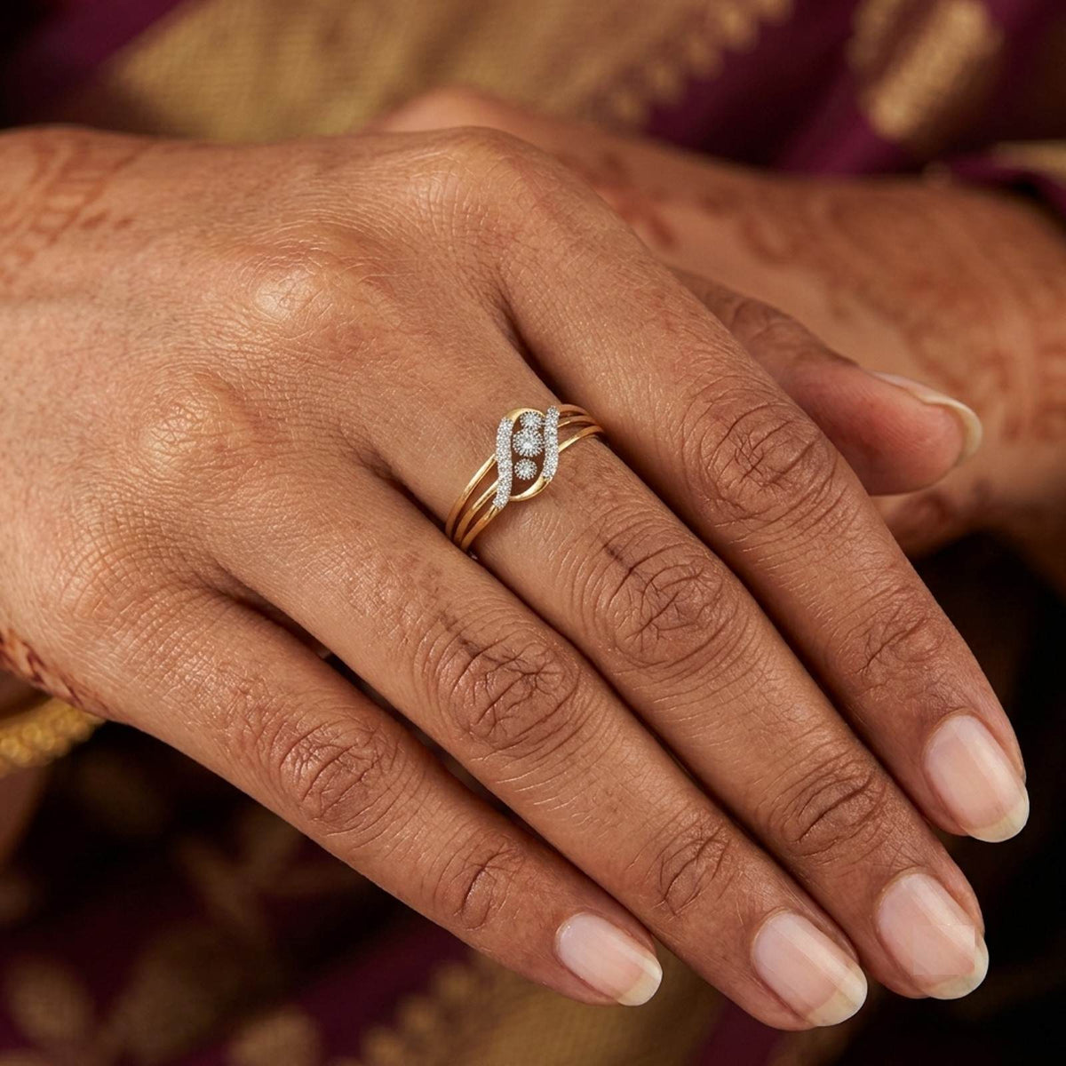 Close-up shot of a gold and diamond women's ring.