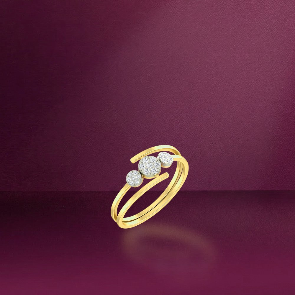Gold ring with three diamond-like stones on a background.