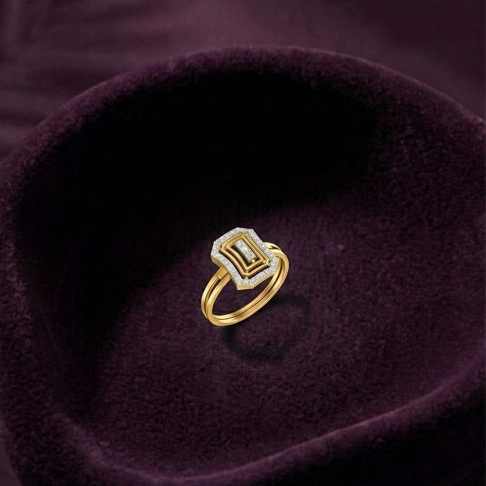 A gold ring with a geometric, stepped rectangular diamond-cut setting, displayed on a deep purple velvet ring box.