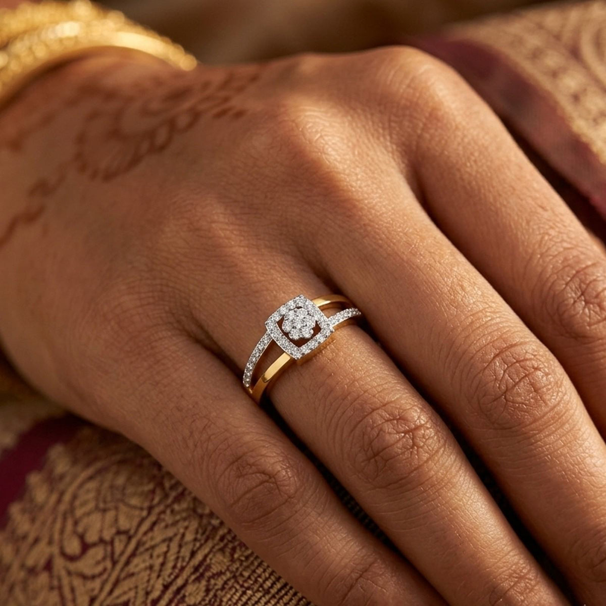 Close-up shot of a gold ring with a square-shaped diamond cluster setting ring.