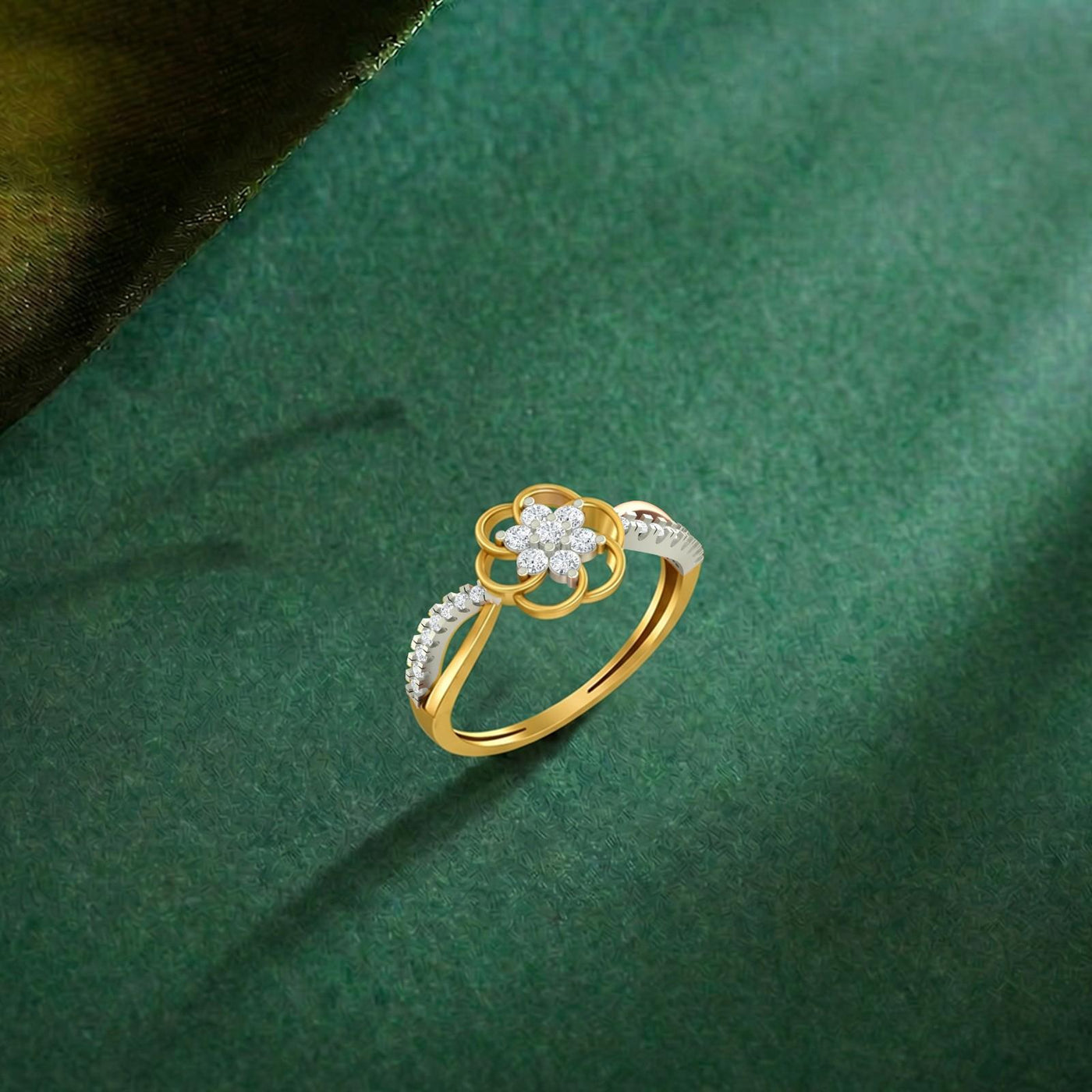 Gold and diamond with floral design on a green surface.