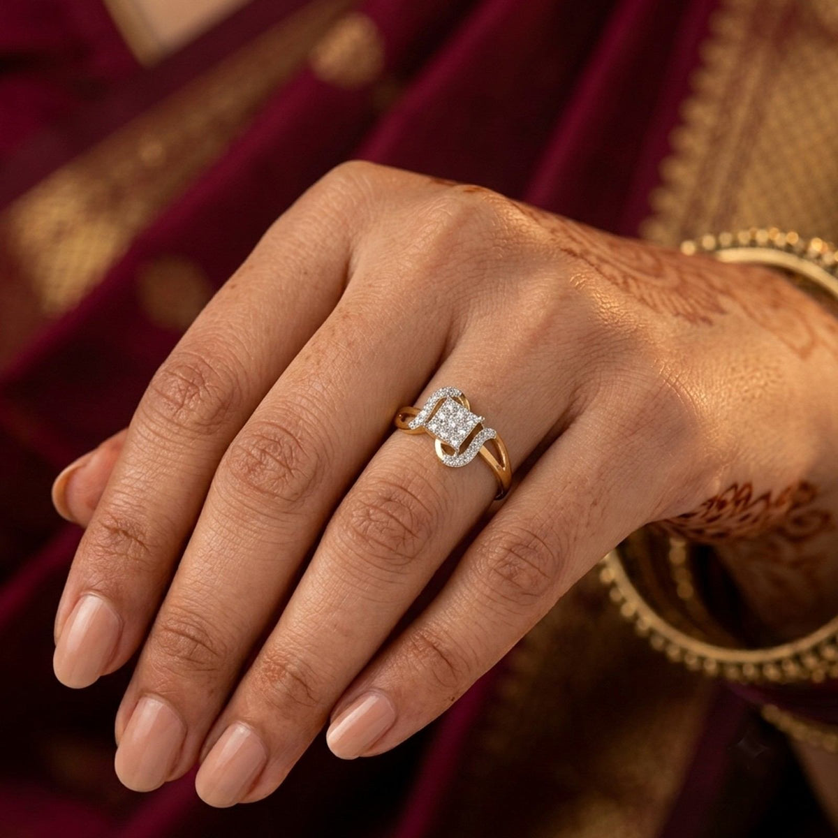 Close-up shot of a gold and diamond cluster women's ring.