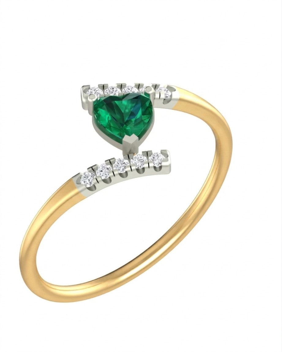 Yellow gold and diamond ring with a heart-shaped emerald on a white background