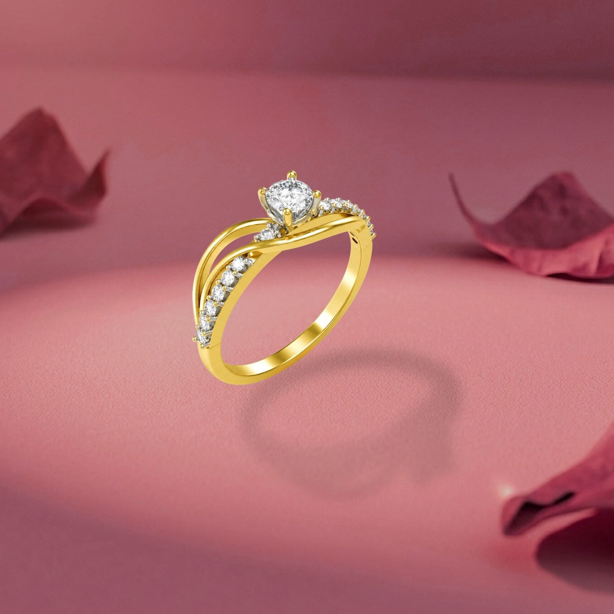 Gold ring with a diamond, shown floating against a soft pink background with blurred rose petals.