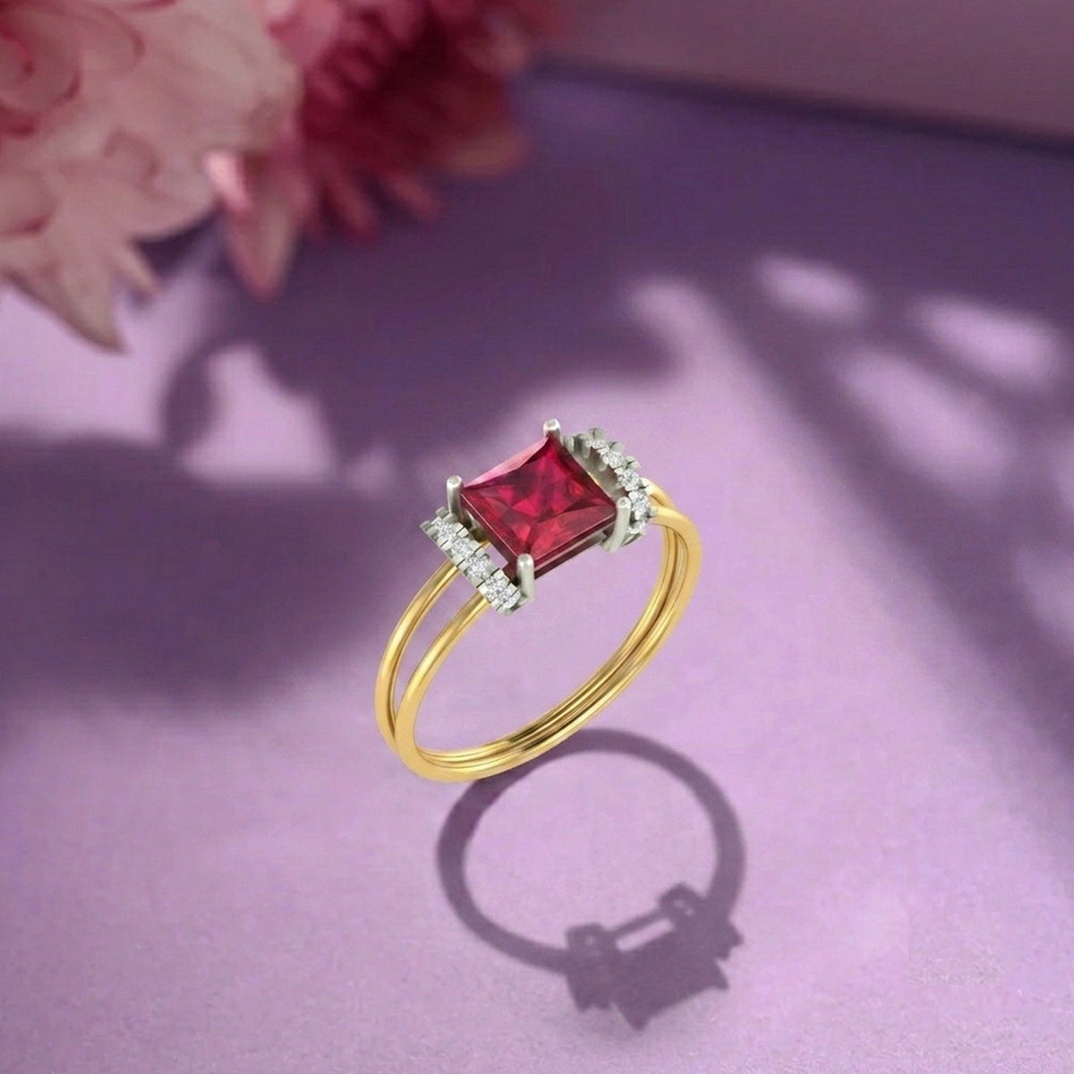 Gold and diamond with ruby gemstone on a fabric surface.