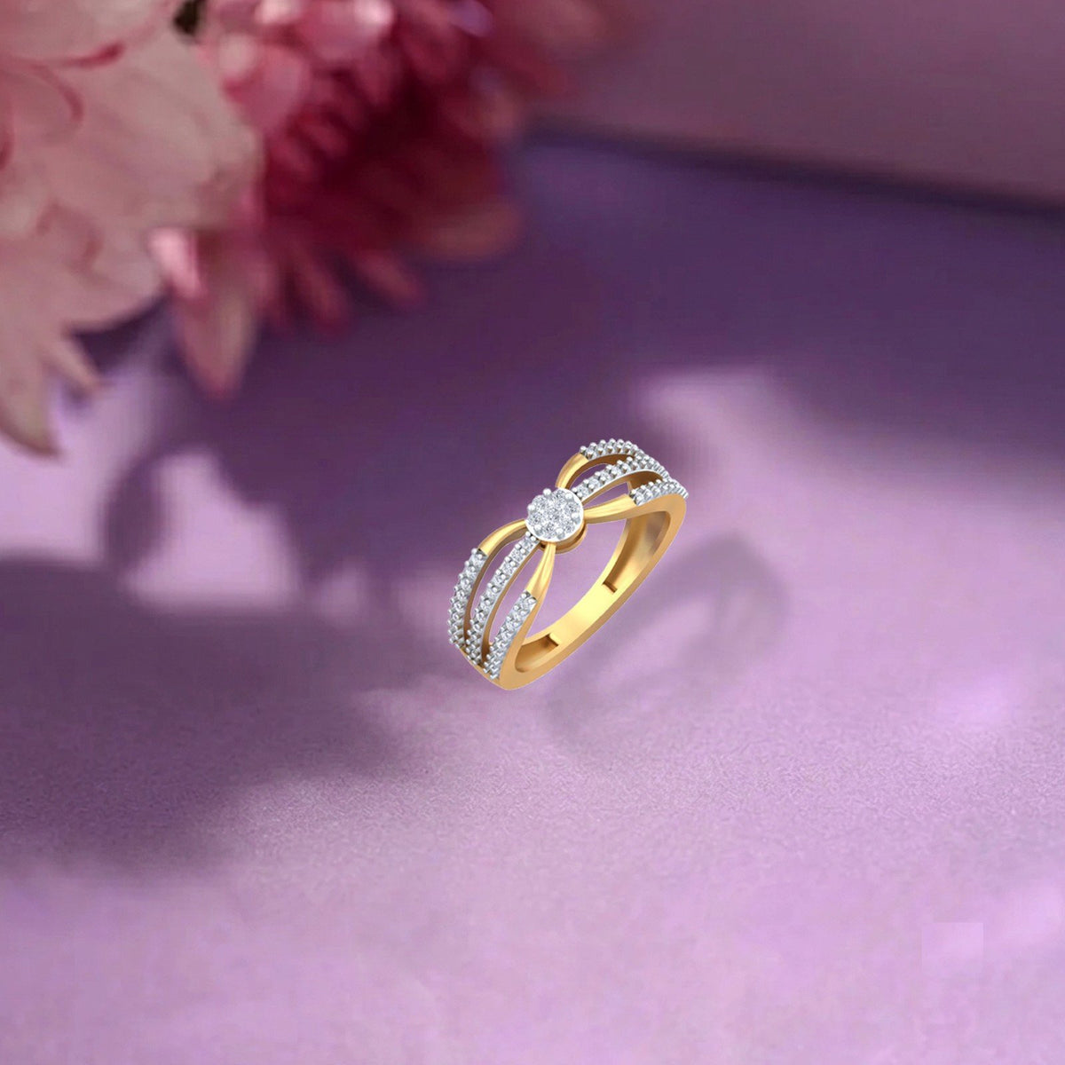 Gold and diamond with cluster women's ring on a purple surface.