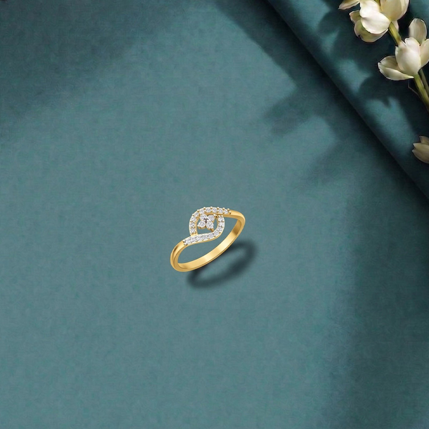 Gold and diamond with floral design on a blue surface.
