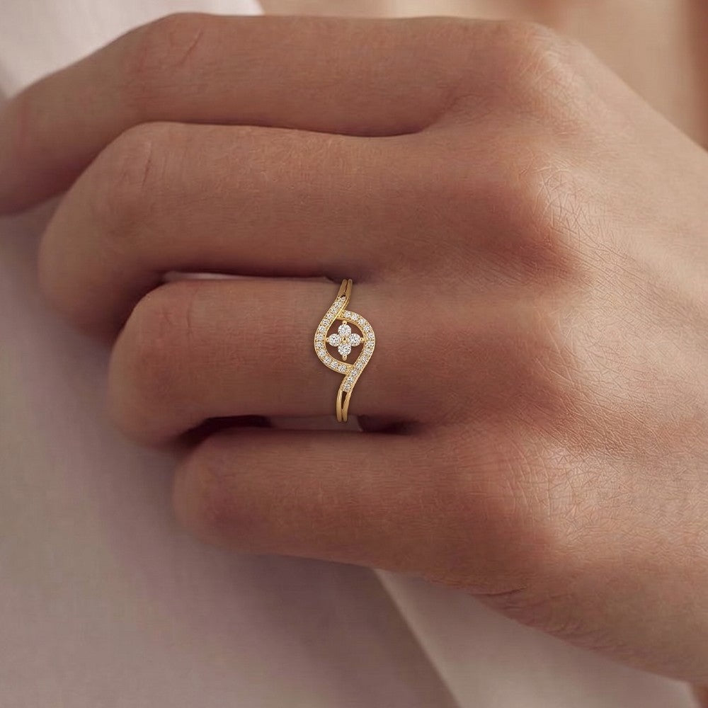 Close-up shot of a gold and diamond with floral design ring