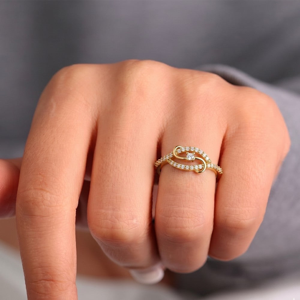 Close-up shot of gold and diamond women's ring.