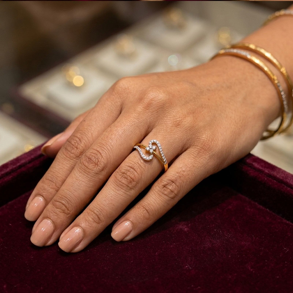Gold ring with diamonds on a person's finger