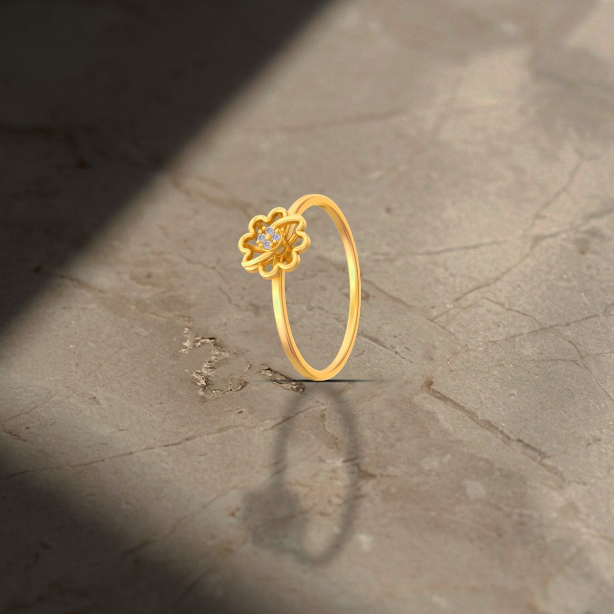 Gold and diamond with floral-design on a brown surface.