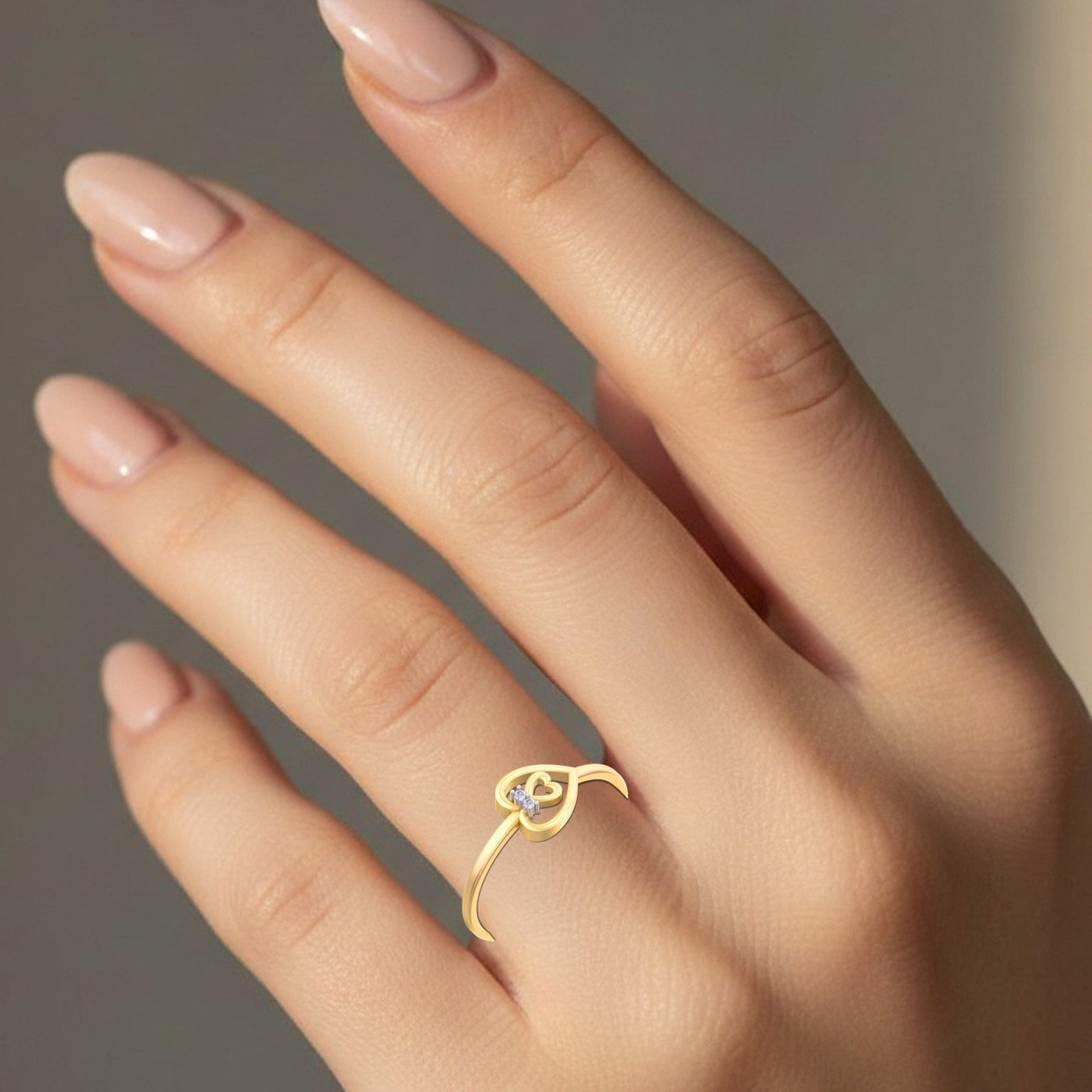 Gold and diamond with heart-shaped on a person's finger.