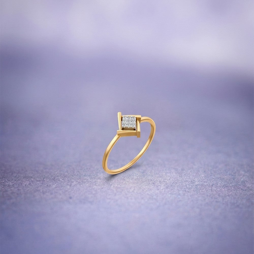 Gold and diamond with square-shaped cluster setting on a blue surface. 