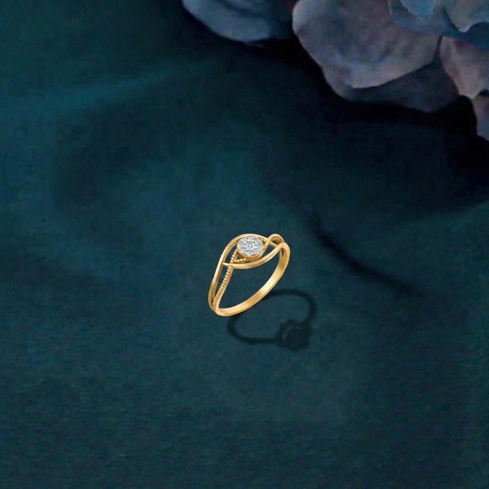 Gold and diamond with cluster setting on a teal background.