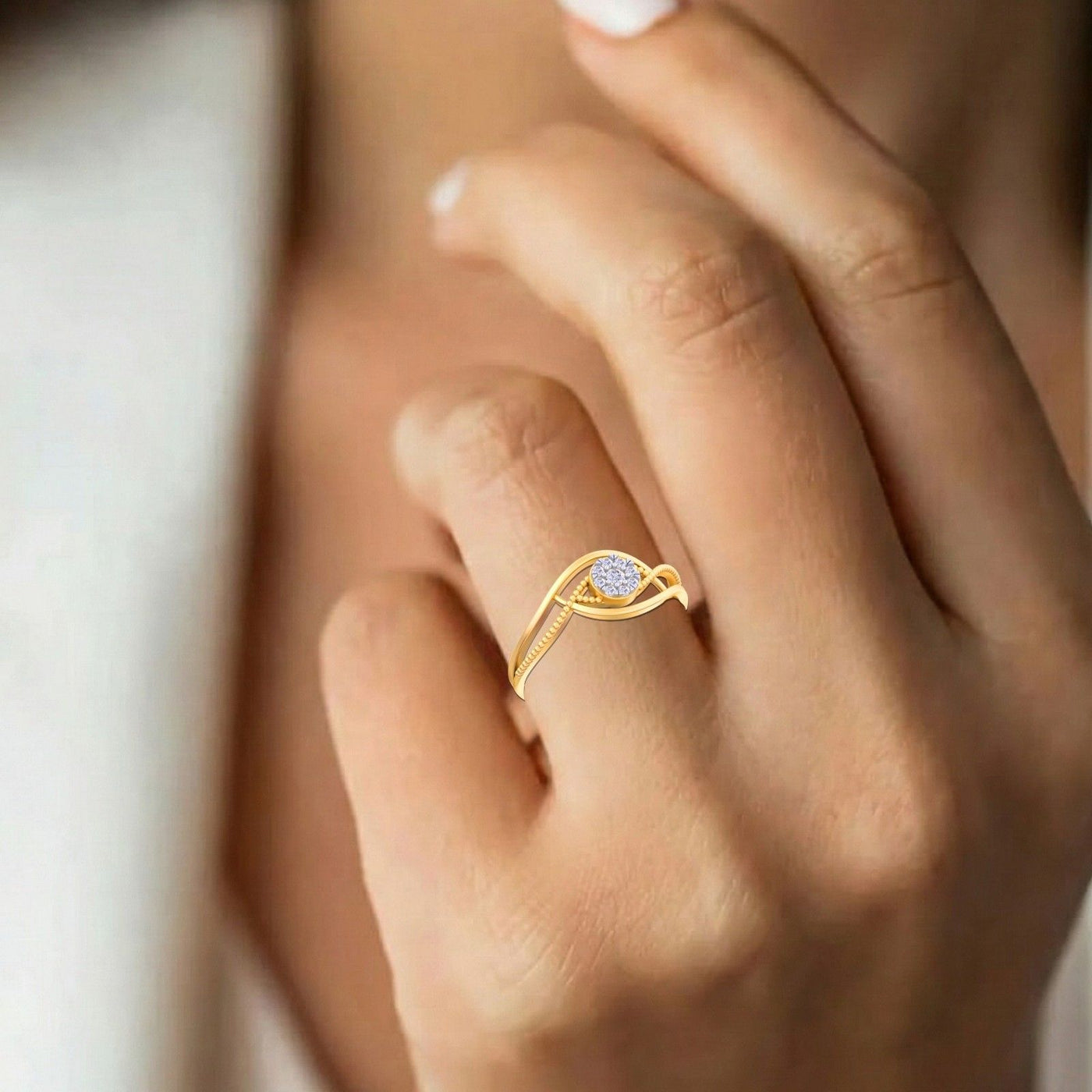Close-up shot of a gold and diamond with cluster setting ring.