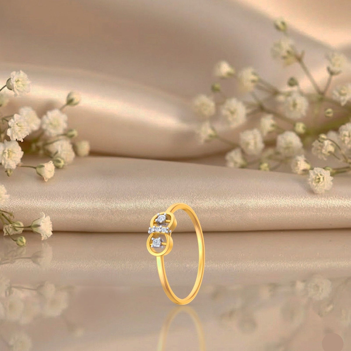 Gold and diamond ring on a brown surface.