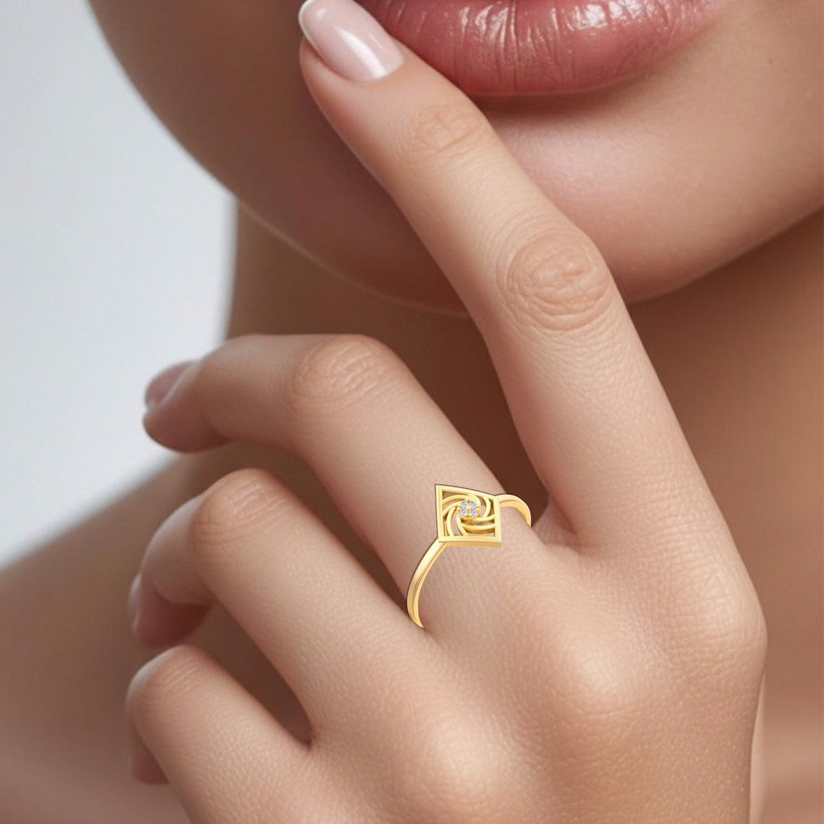 Gold and diamond women's ring on a person's finger.