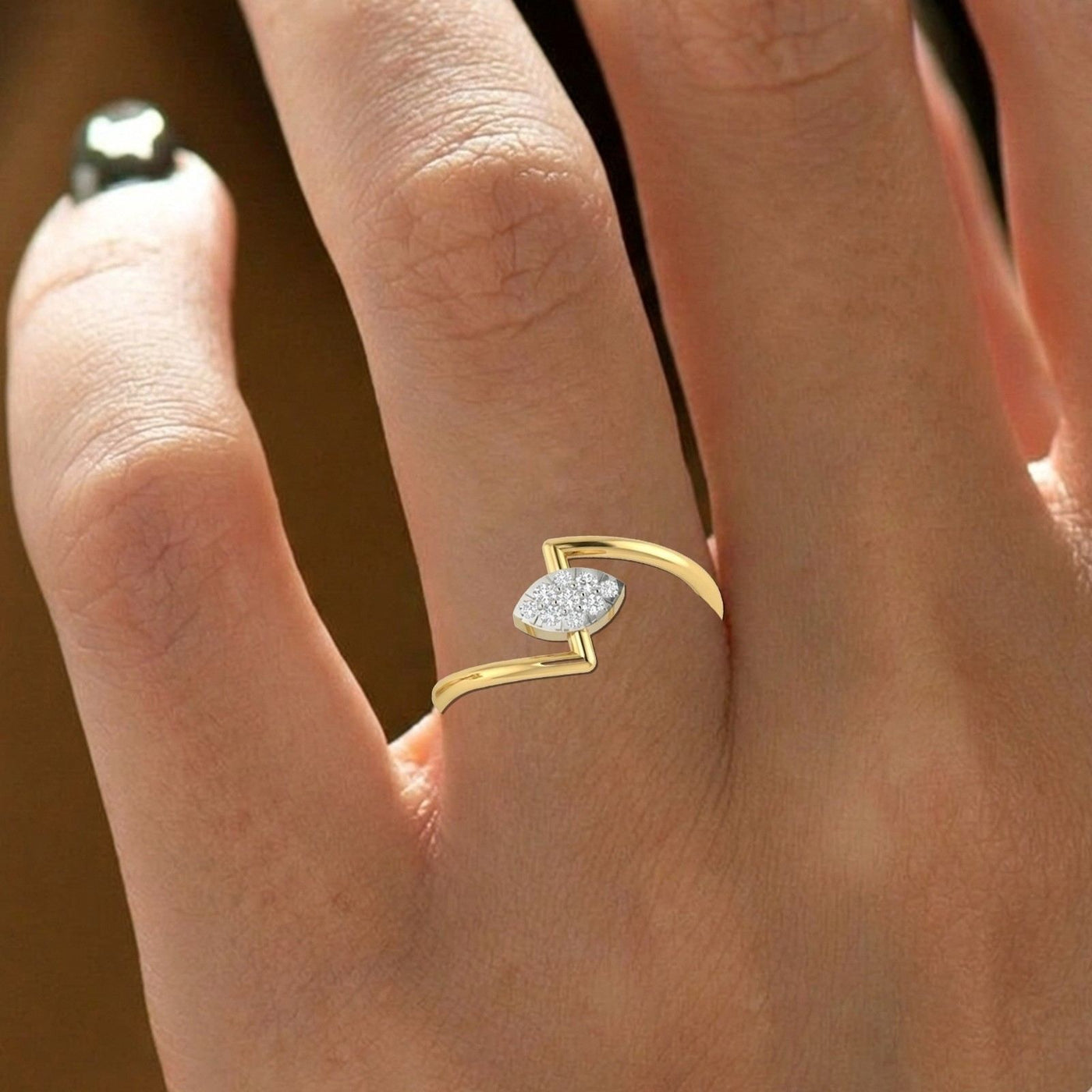 Close-up shot of a gold and diamond with cluster setting ring.