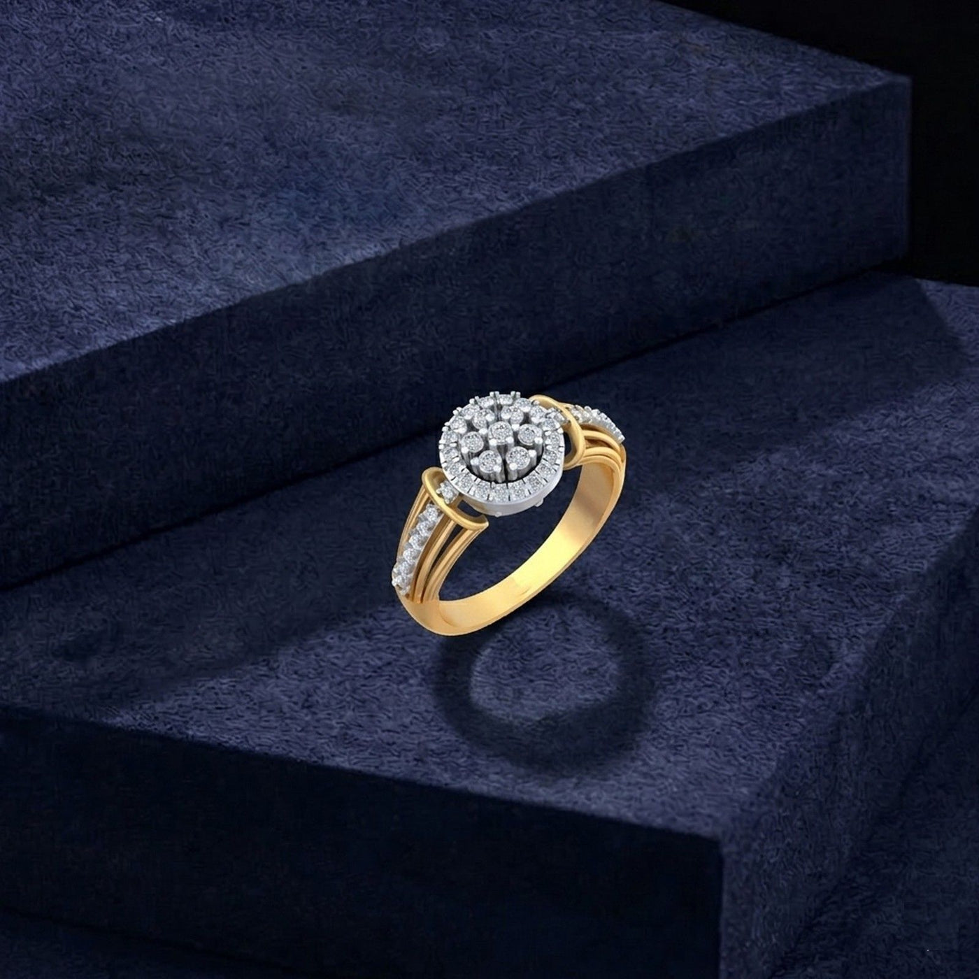 A gold and diamond ring with a circular halo, displayed on a dark navy velvet block.
