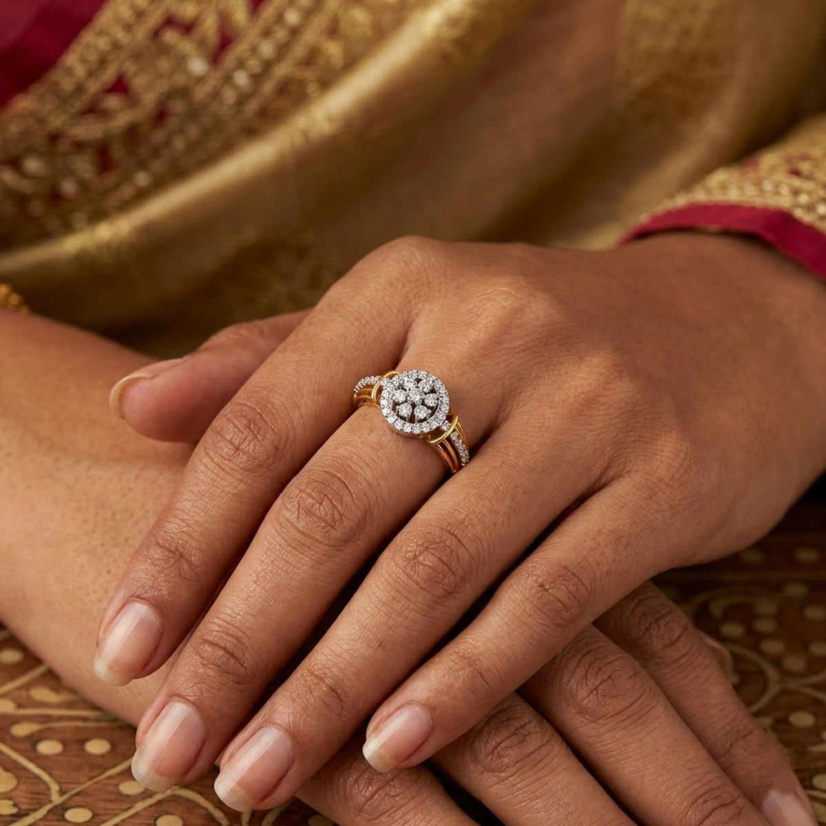 Close-up shot of a gold and diamond ring with cluster design.