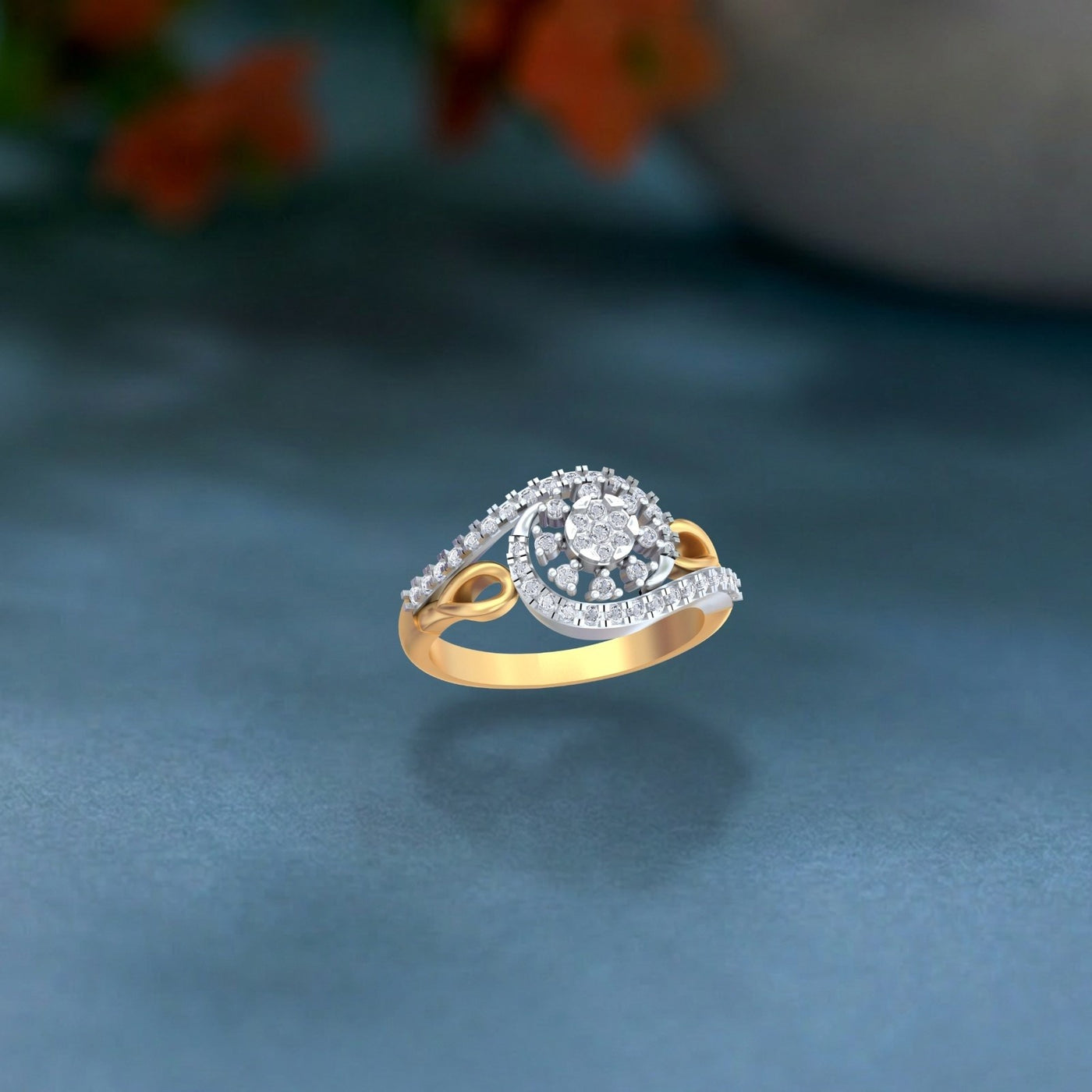 Gold ring with diamonds cluster ring on a blue surface.
