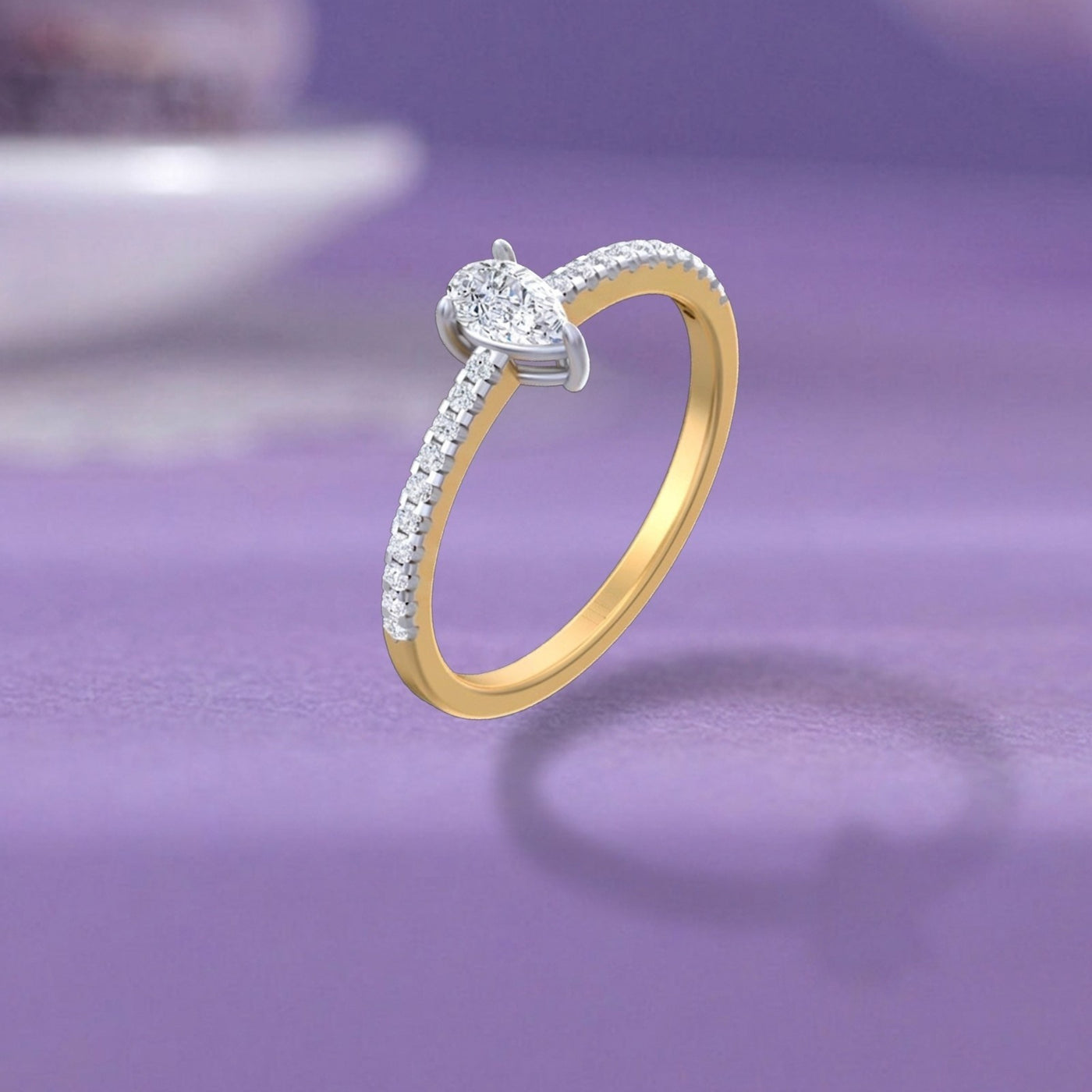 Gold and diamond ring with diamonds on a purple background.