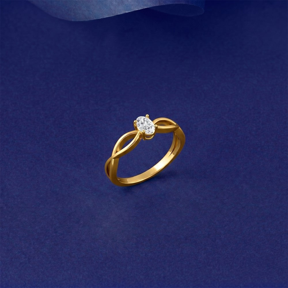 Gold ring with a diamond on a blue background