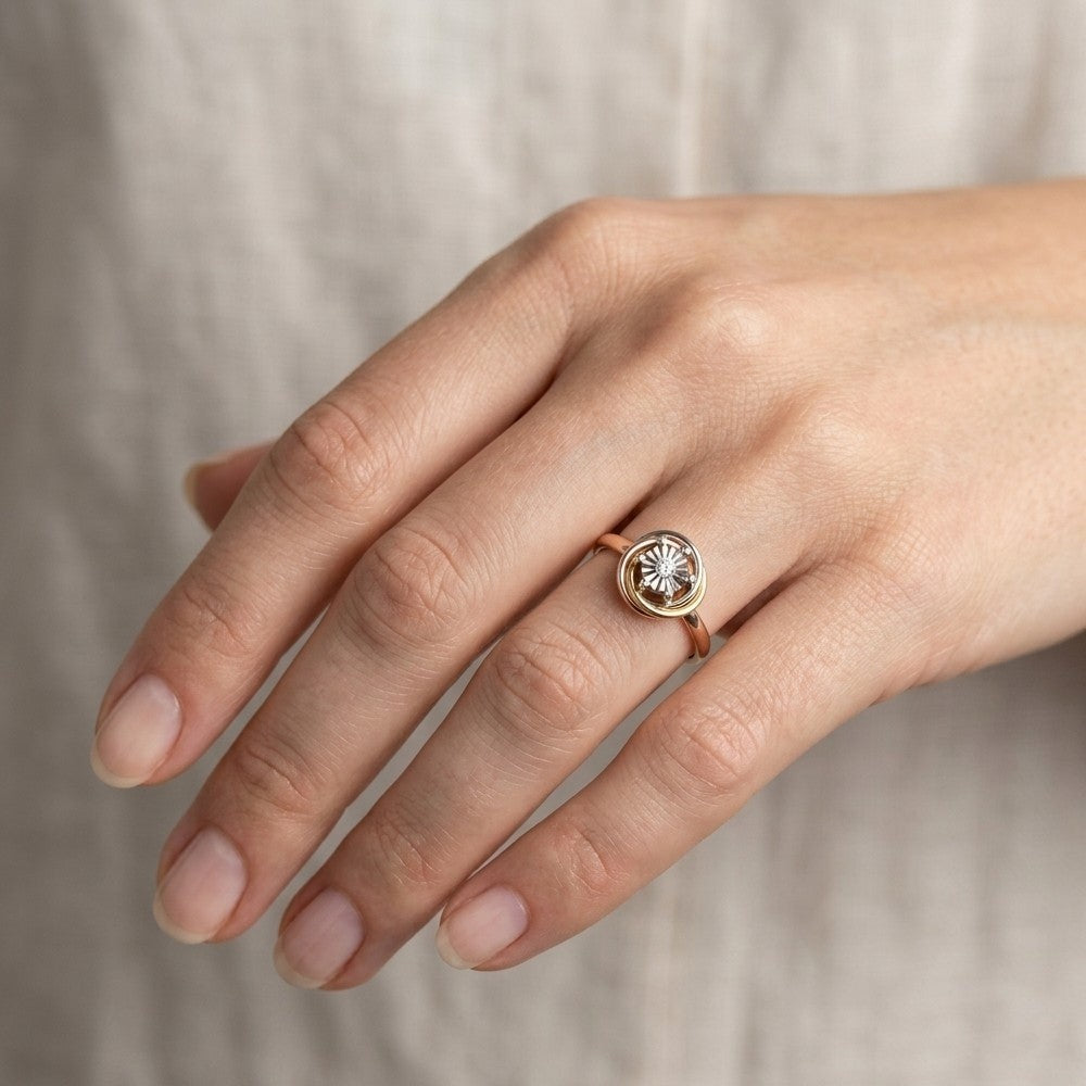 Close-up shotd of a gold and diamond women's ring.