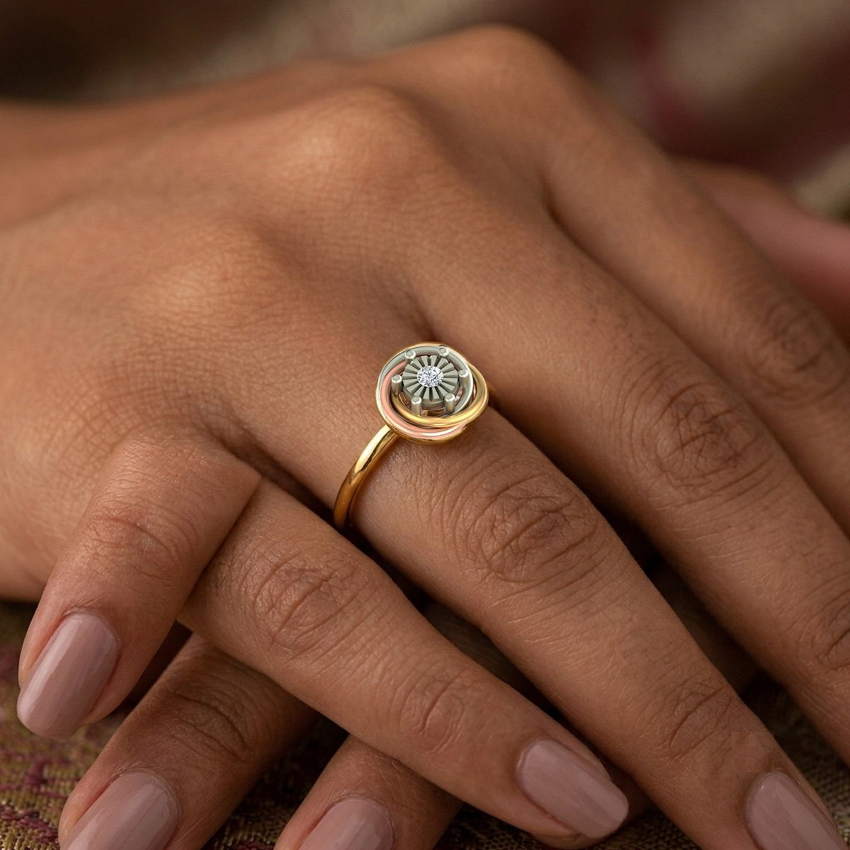 Close-up shot of a gold and diamond women's ring.