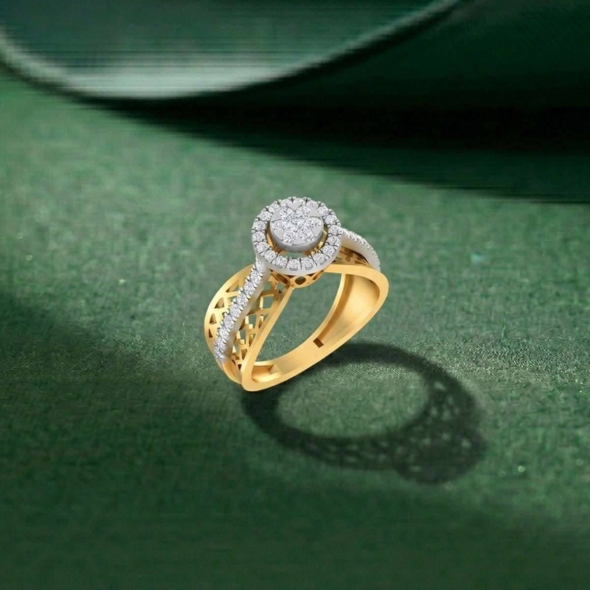 Gold ring with diamond accents on a green textured surface