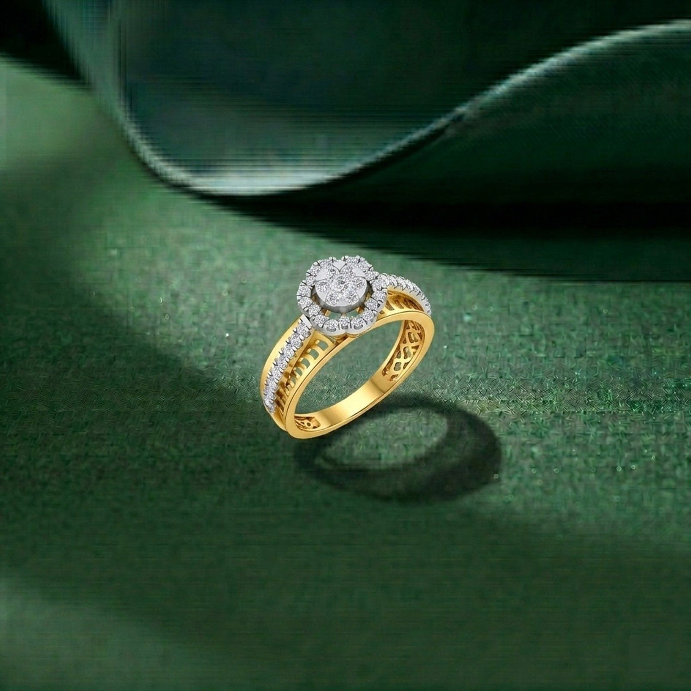 A gold ring with a round-cut diamond center stonne, resting on a textured dark green surface.