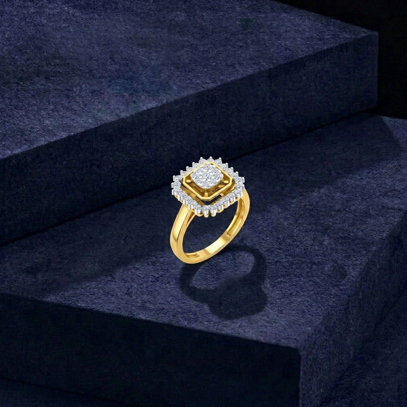 Gold ring with a diamond centerpiece on a blue surface.