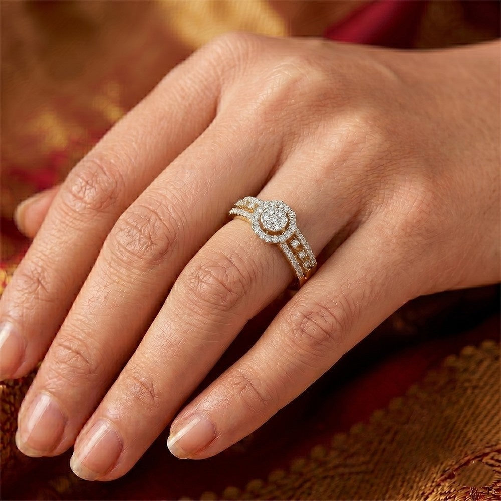 A close-up of a hand wearing a diamond engagement ring with a round-cut center.