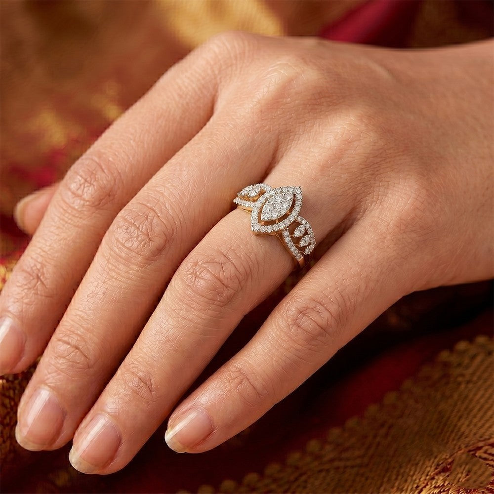 Close-up of a hand wearing a diamond ring with a blurred background