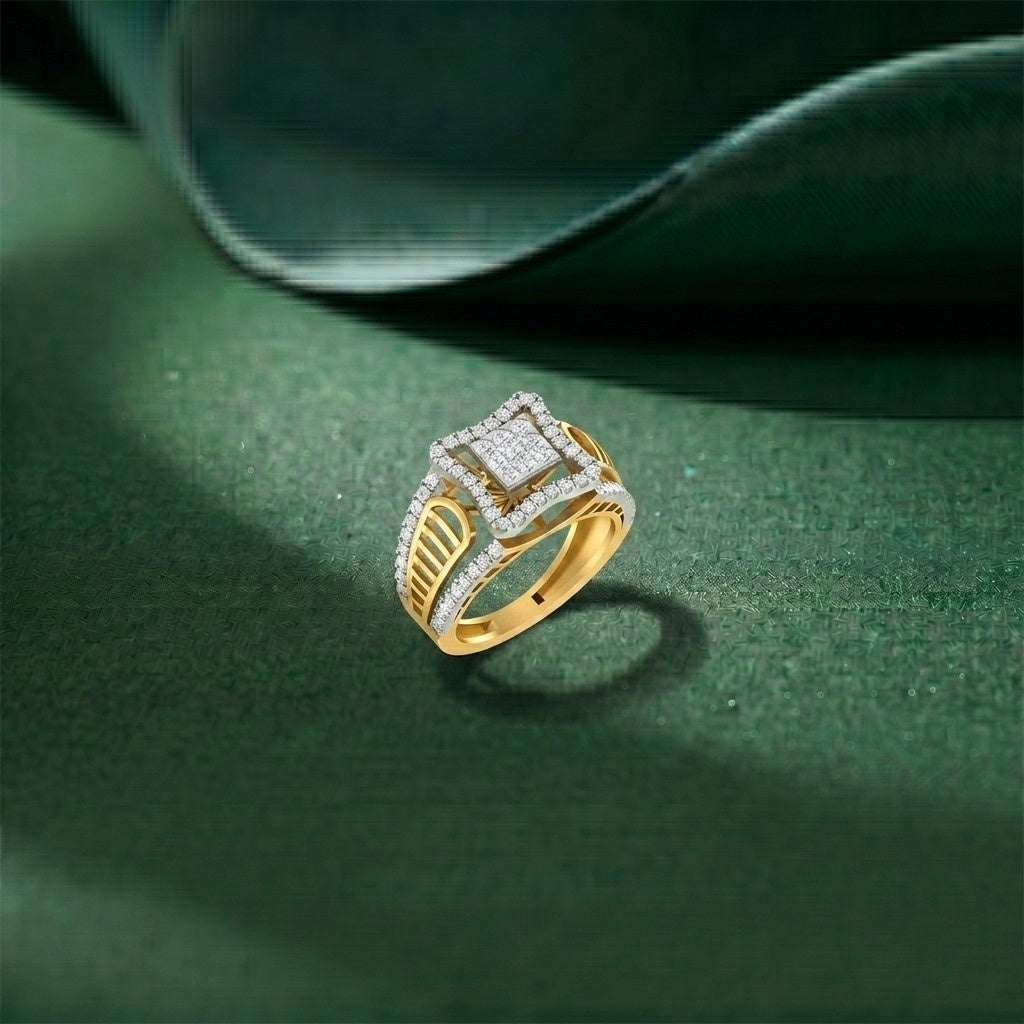 Gold halo ring with diamonds on a green surface.