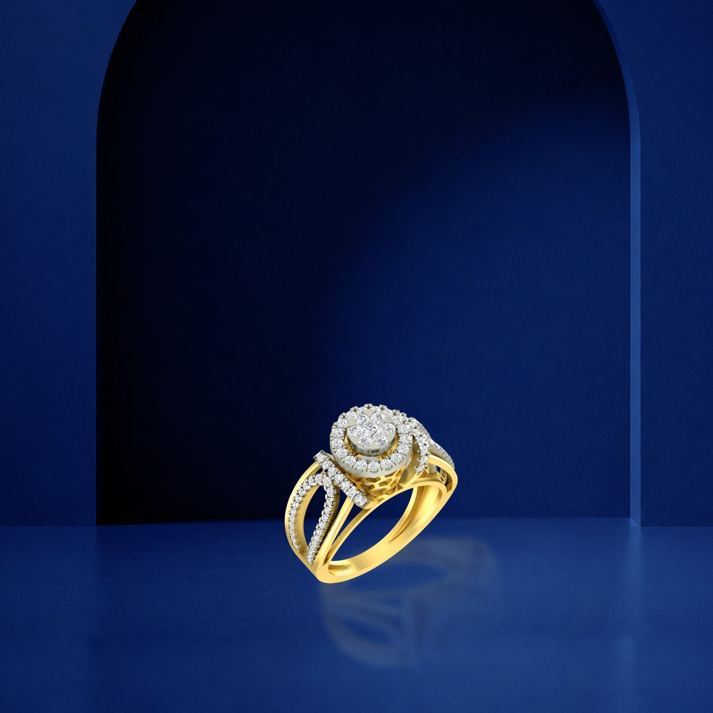 A gold ring and diamond with a halo of small, displayed on a blue reflective surface.