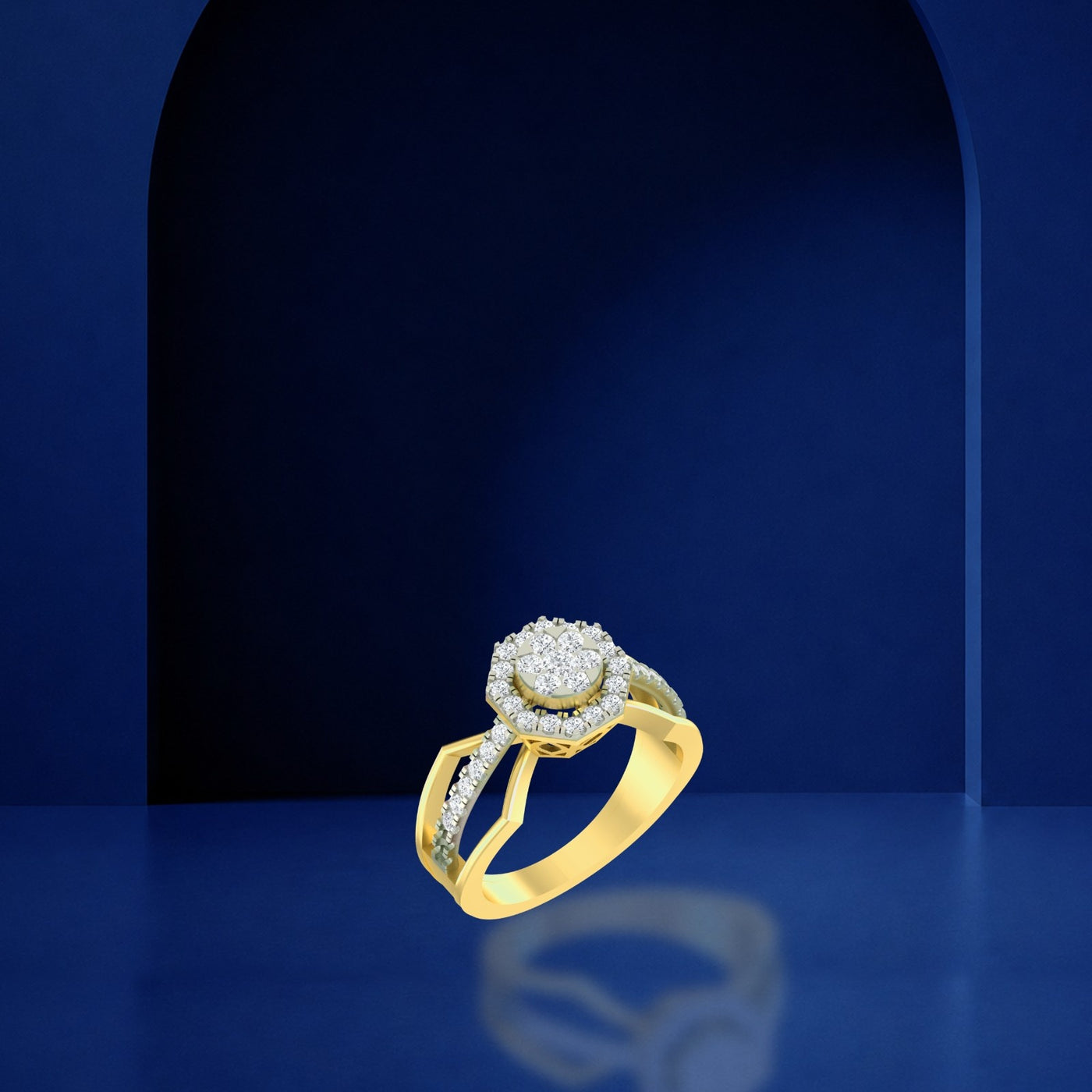 A gold engagement ring with a pavé diamond halo, displayed on a reflective dark blue surface.
