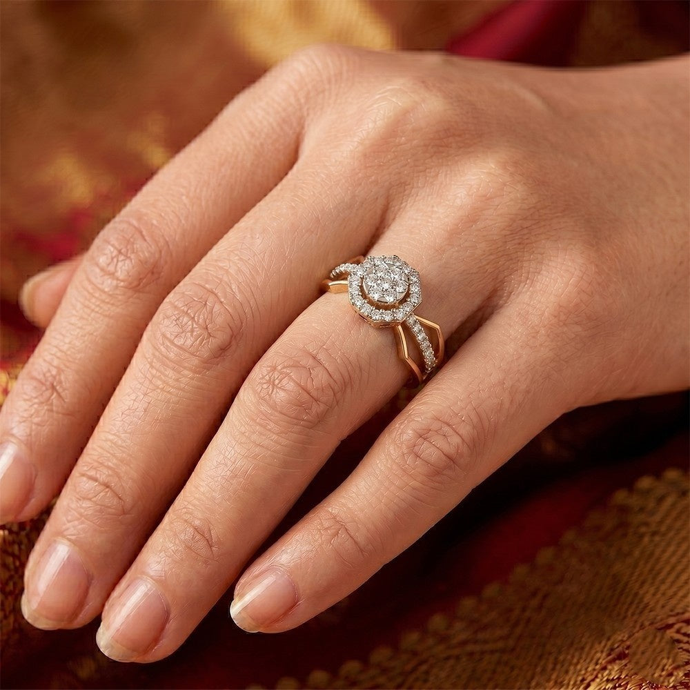 Close-up of a hand wearing a diamond ring with a blurred background