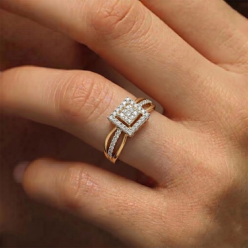 Rose gold ring with diamonds on a person's finger
