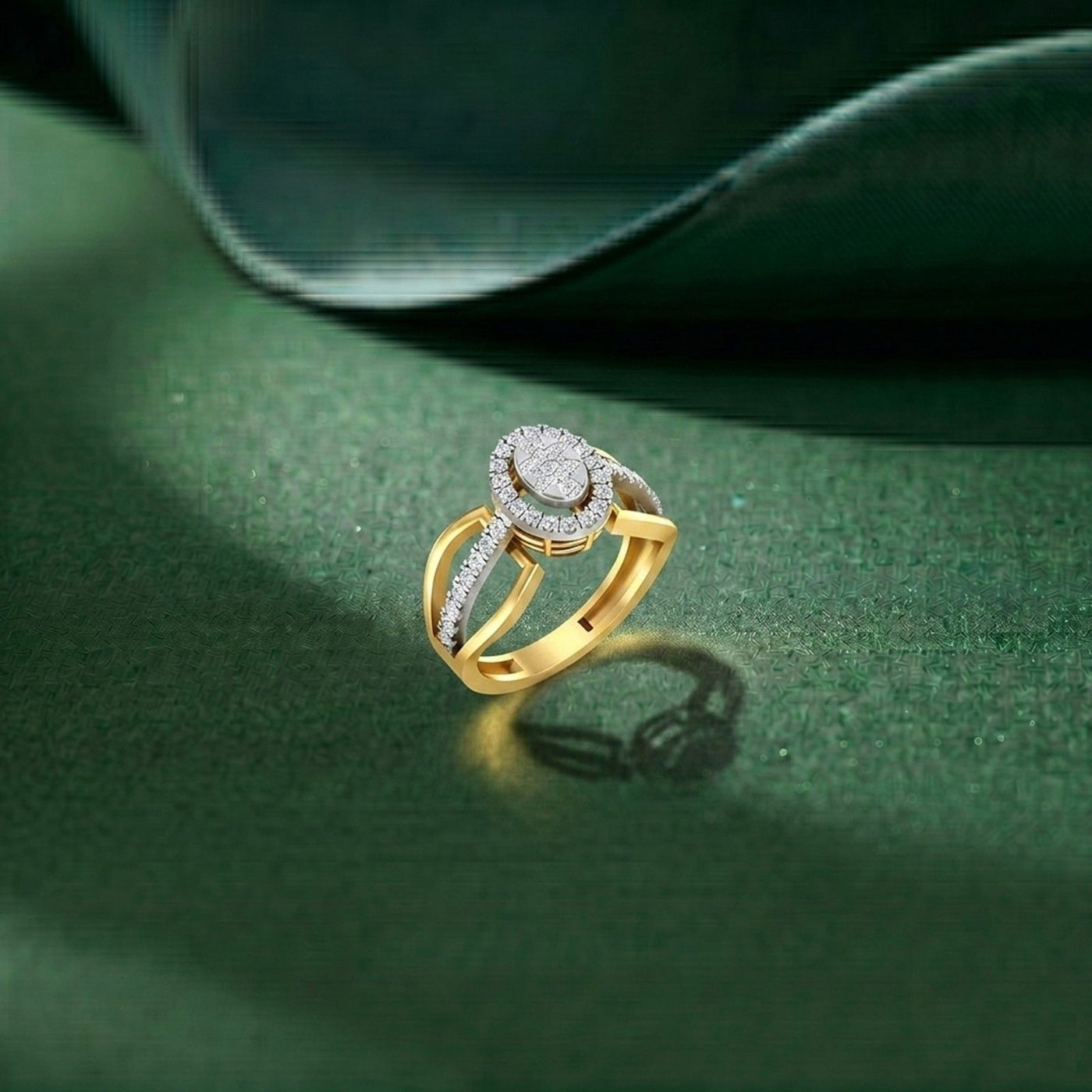 Gold ring with diamonds on a green surface.