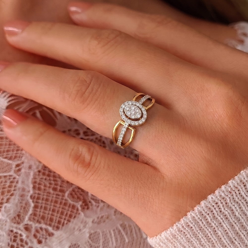 Close-up of a hand wearing a gold ring with a diamond on a lace background