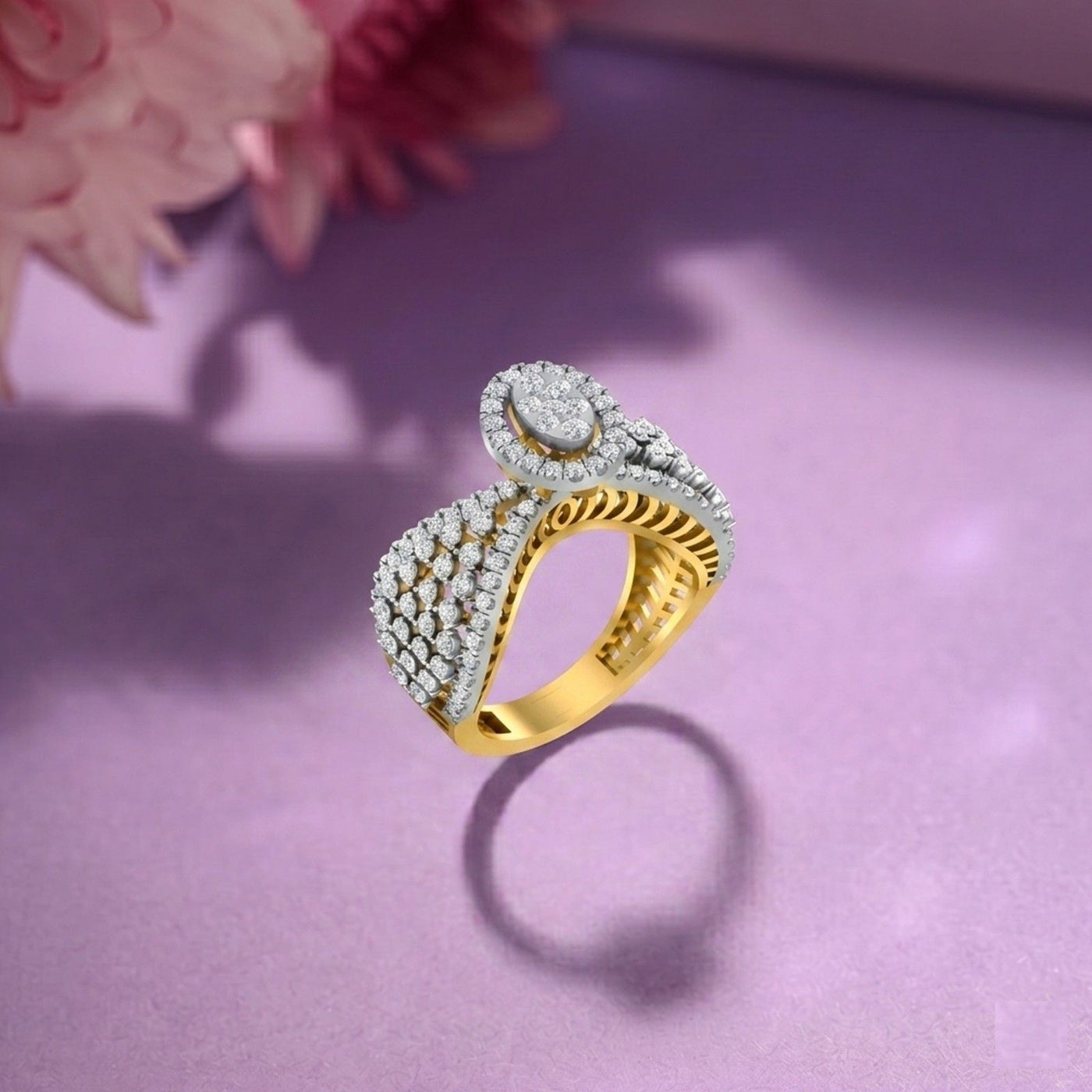 Gold and diamond ring on a purple surface with floral background.