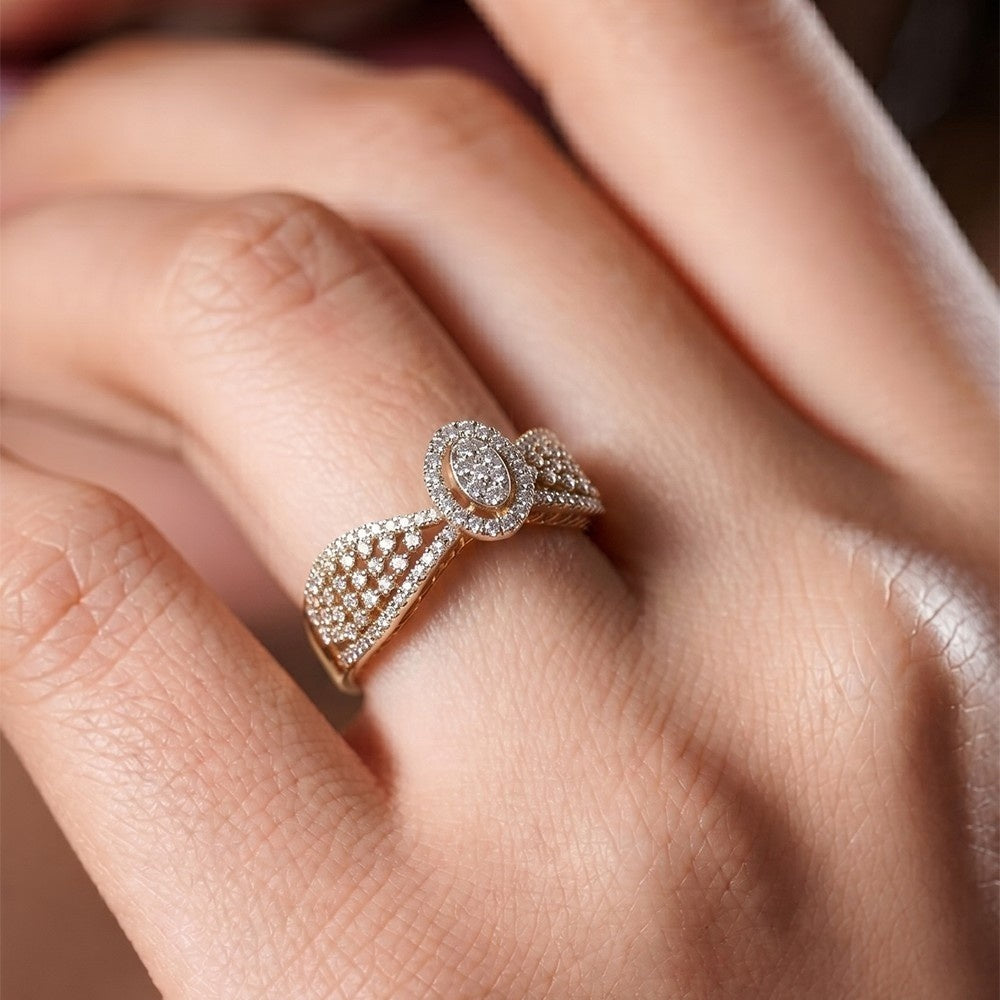 Gold ring with diamonds on a person's finger.