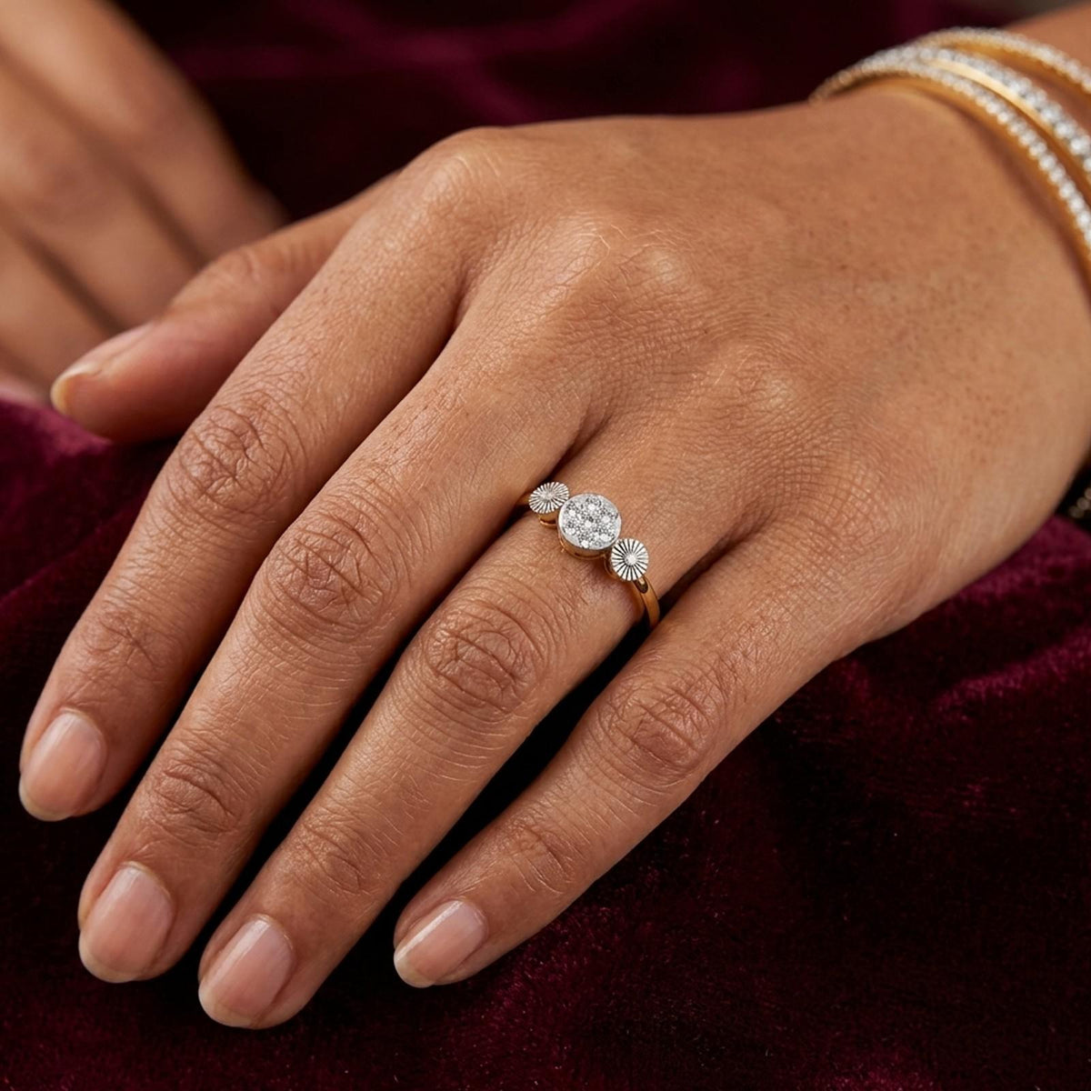 Close-up shot of a gold and diamond women's ring.