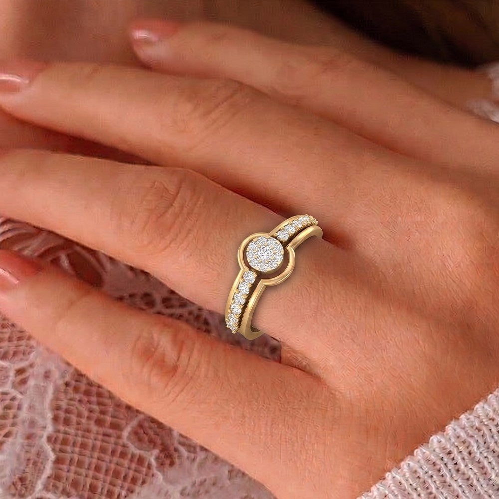 Gold ring with a diamond on a person's finger against a lace background
