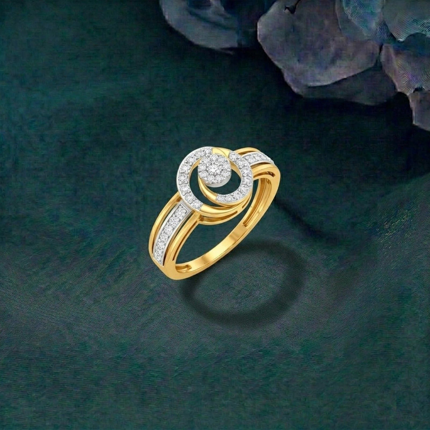 Gold and diamonds with halo design ring on a textured green background.